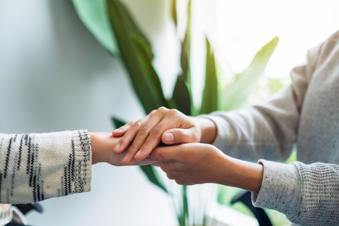 Women holding each other hands